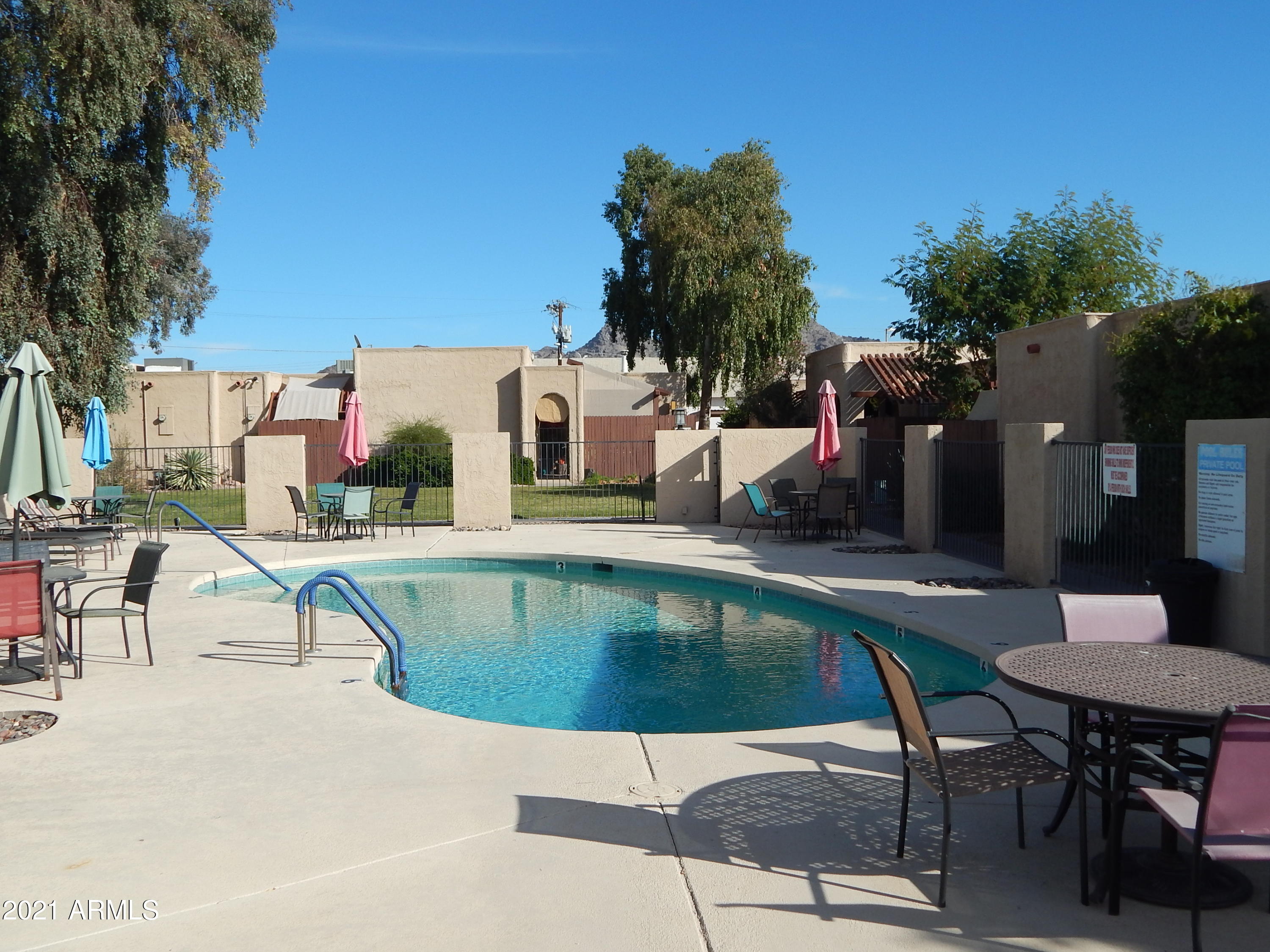 1024 East Pueblo Road Phoenix, AZ 85020 - Photo 1 of 9 a swimming pool with outdoor seating and yard