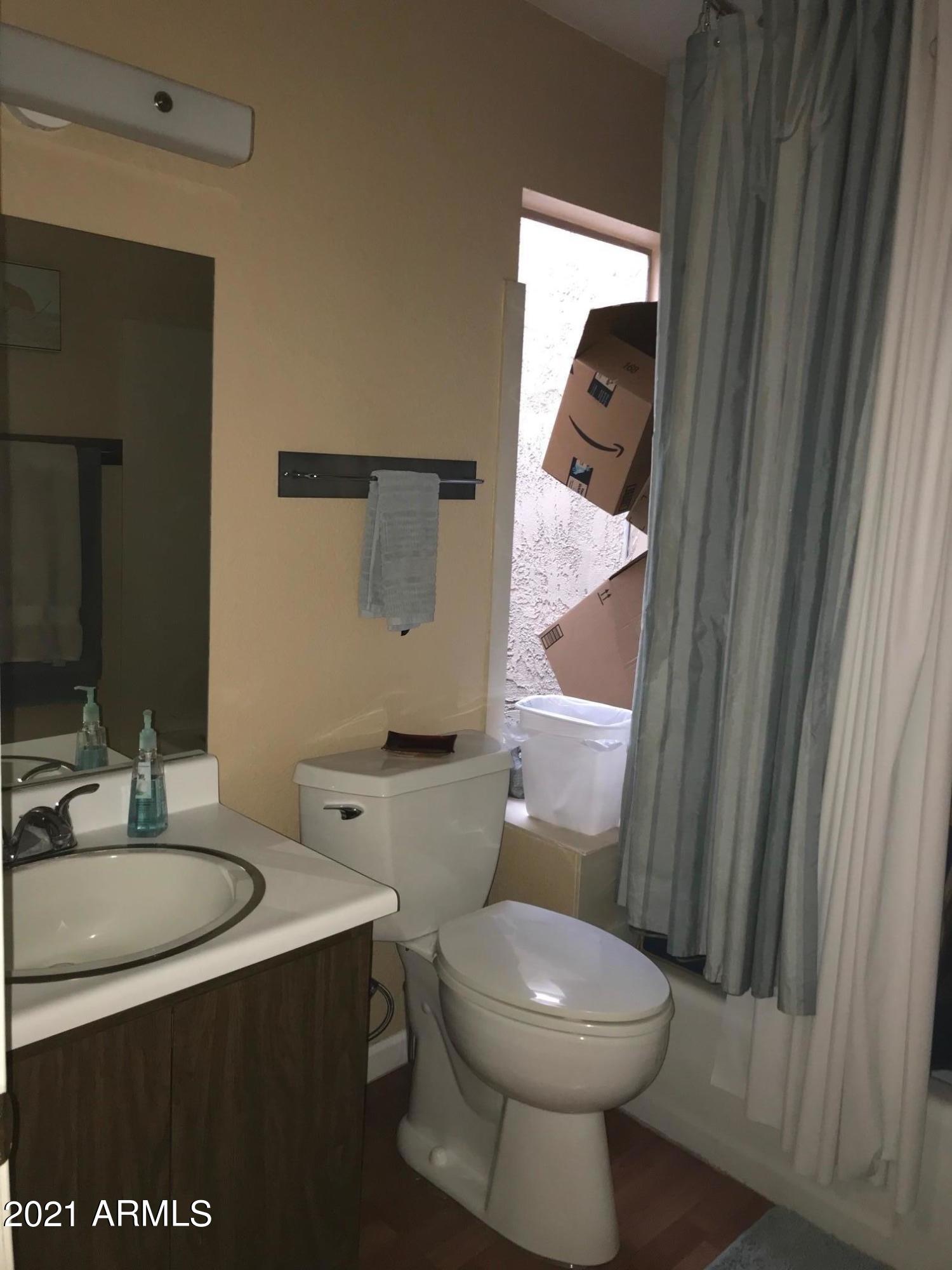 1024 East Pueblo Road Phoenix, AZ 85020 - Photo 5 of 9 a bathroom with a toilet a sink and mirror