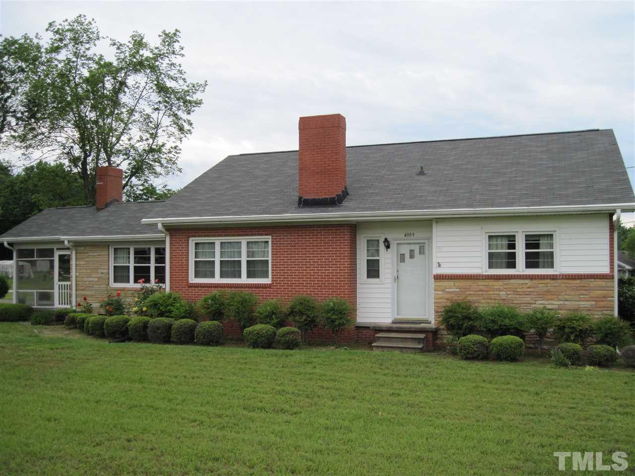 4009 St James Church Road Raleigh, NC 27604 - Photo 17 of 17 a front view of a house with a garden