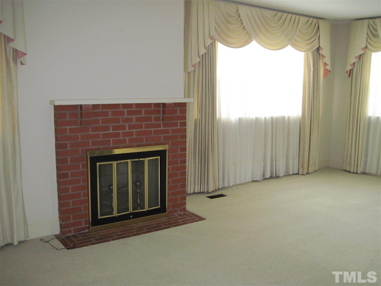 4009 St James Church Road Raleigh, NC 27604 - Photo 3 of 17 a view of a fireplace in a room