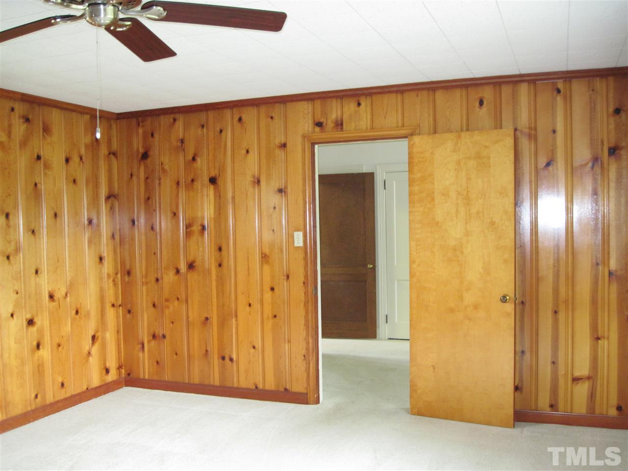 4009 St James Church Road Raleigh, NC 27604 - Photo 6 of 17 a view of a room with wooden walls