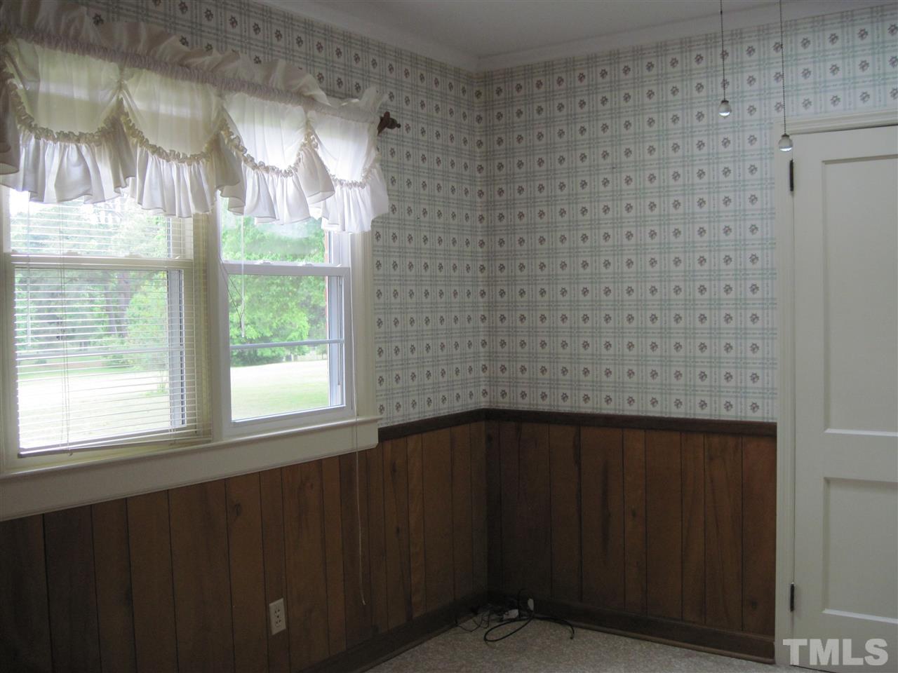 4009 St James Church Road Raleigh, NC 27604 - Photo 9 of 17 a view of wooden floor and windows in a room