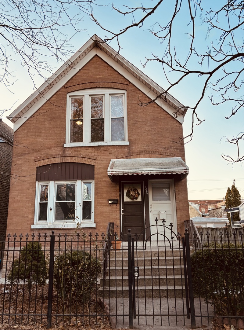 a front view of a house with glass windows