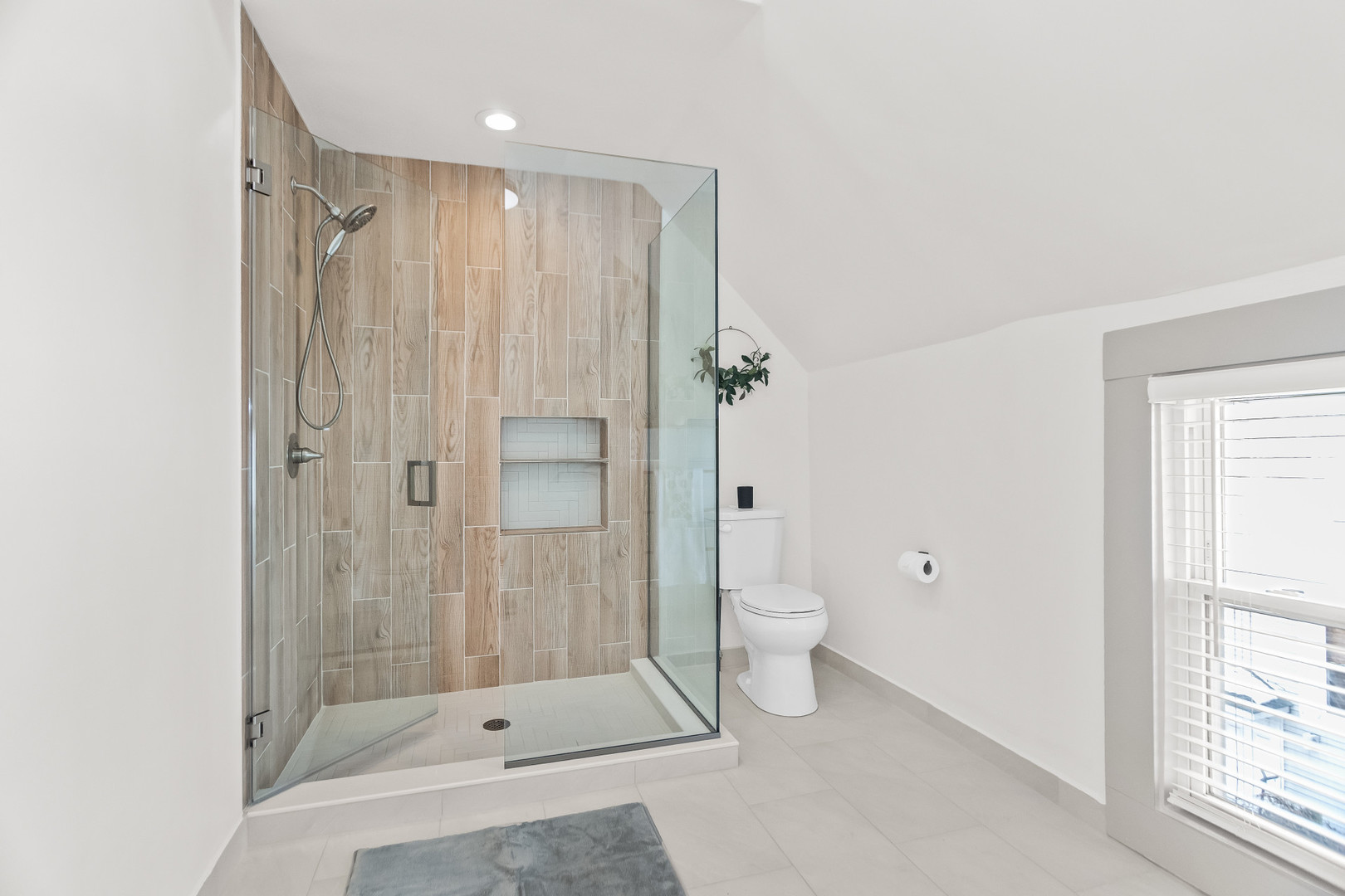 2846 North Troy Street, Unit 2 Chicago, IL 60618 - Photo 3 of 18 a bathroom with a shower and a toilet