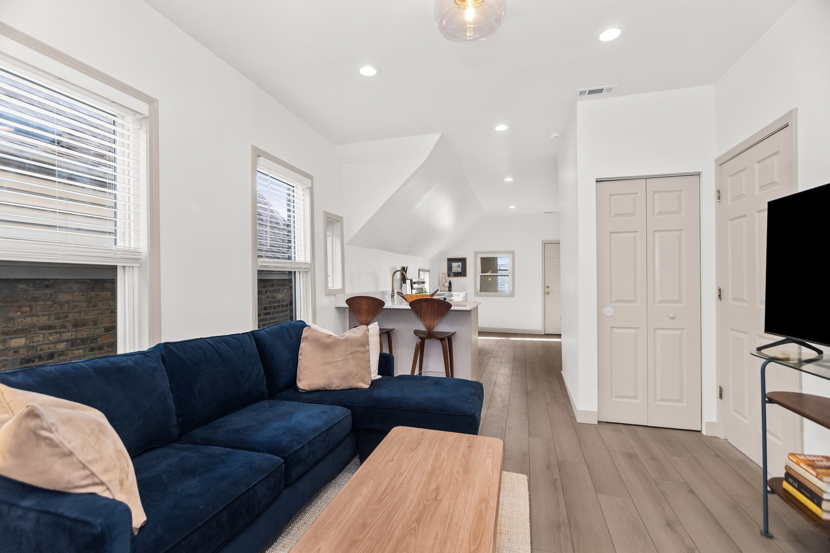 2846 North Troy Street, Unit 2 Chicago, IL 60618 - Photo 5 of 18 a living room with furniture and a flat screen tv