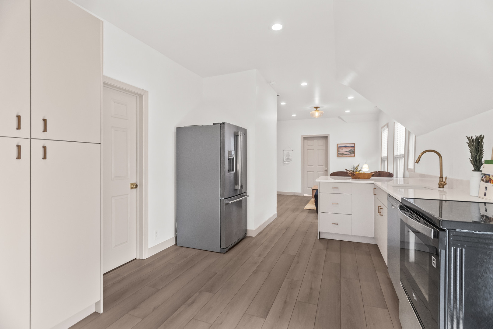 2846 North Troy Street, Unit 2 Chicago, IL 60618 - Photo 7 of 18 a kitchen with sink refrigerator and cabinets