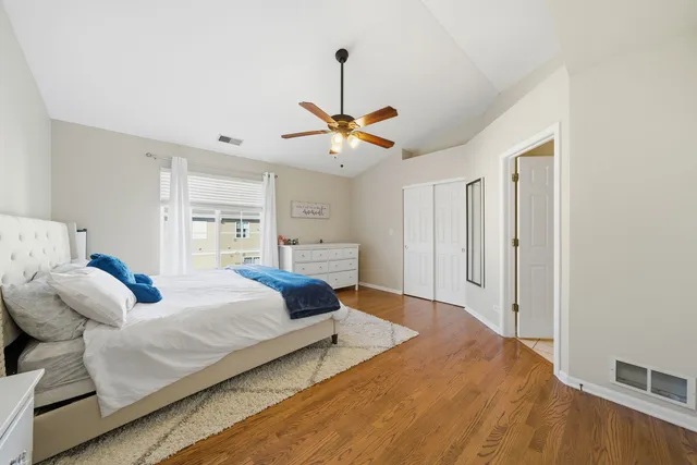 a bedroom with a bed and window