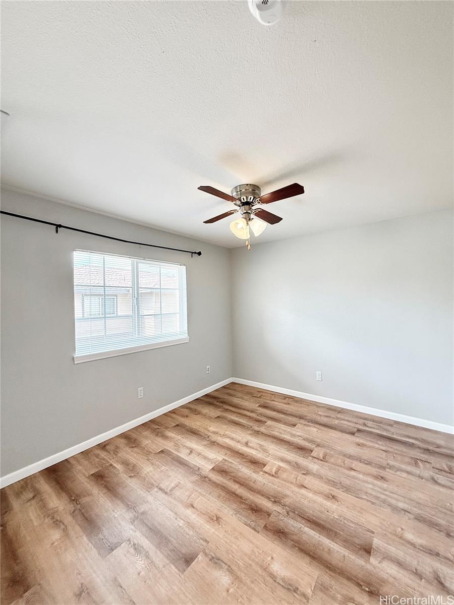 580 Lunalilo Home Road, Unit B340 Honolulu, HI 96825 - Photo 13 of 21 a view of a big room with wooden floor closet and windows