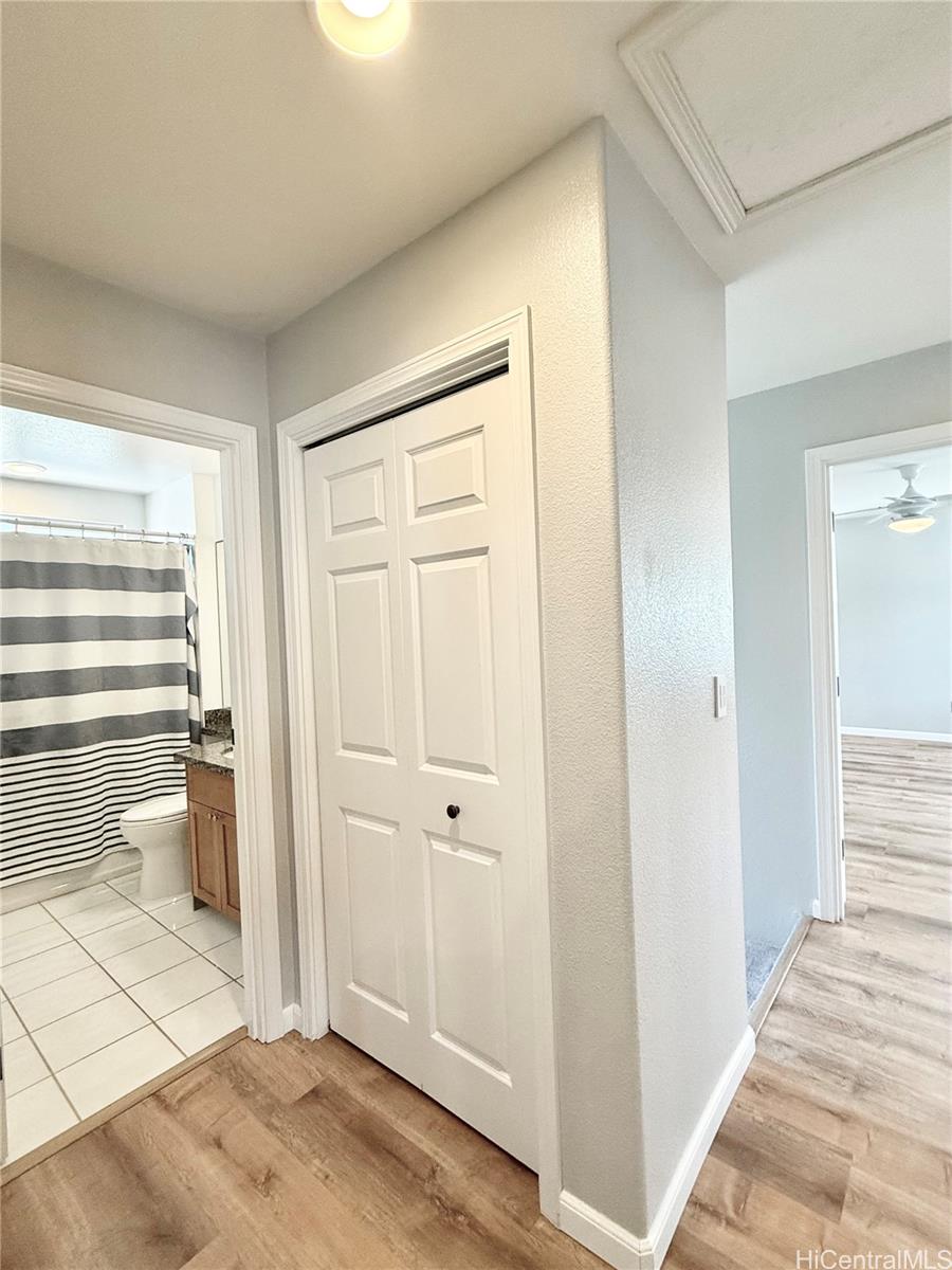 580 Lunalilo Home Road, Unit B340 Honolulu, HI 96825 - Photo 16 of 21 a view of a room with wooden floor and cabinet