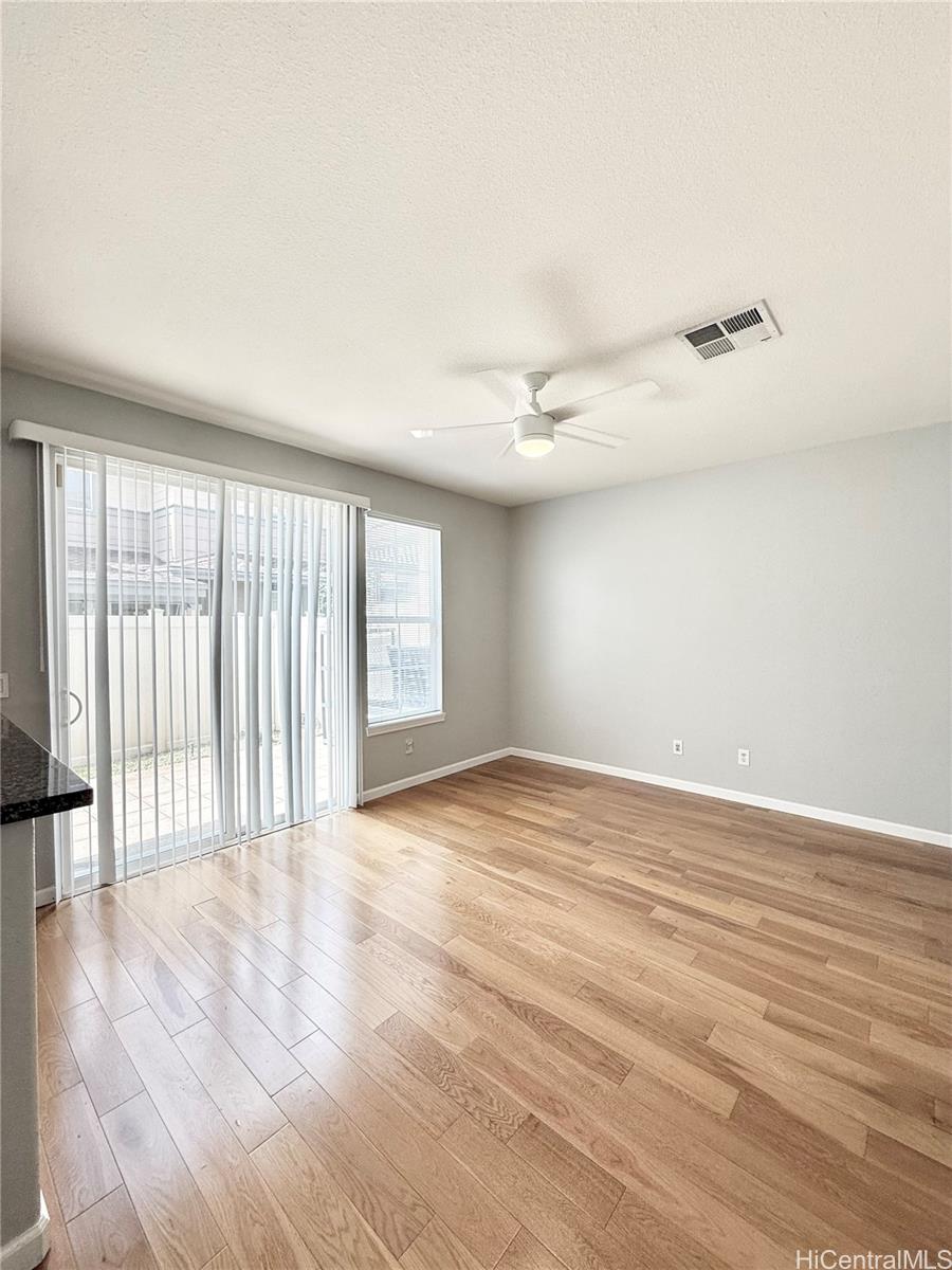 580 Lunalilo Home Road, Unit B340 Honolulu, HI 96825 - Photo 6 of 21 wooden floor in an empty room with a window