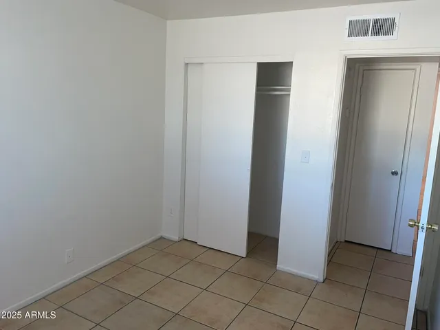 an empty room with closet