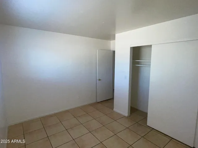 a white stove top oven sitting inside of a kitchen