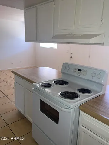 a kitchen with a sink and refrigerator