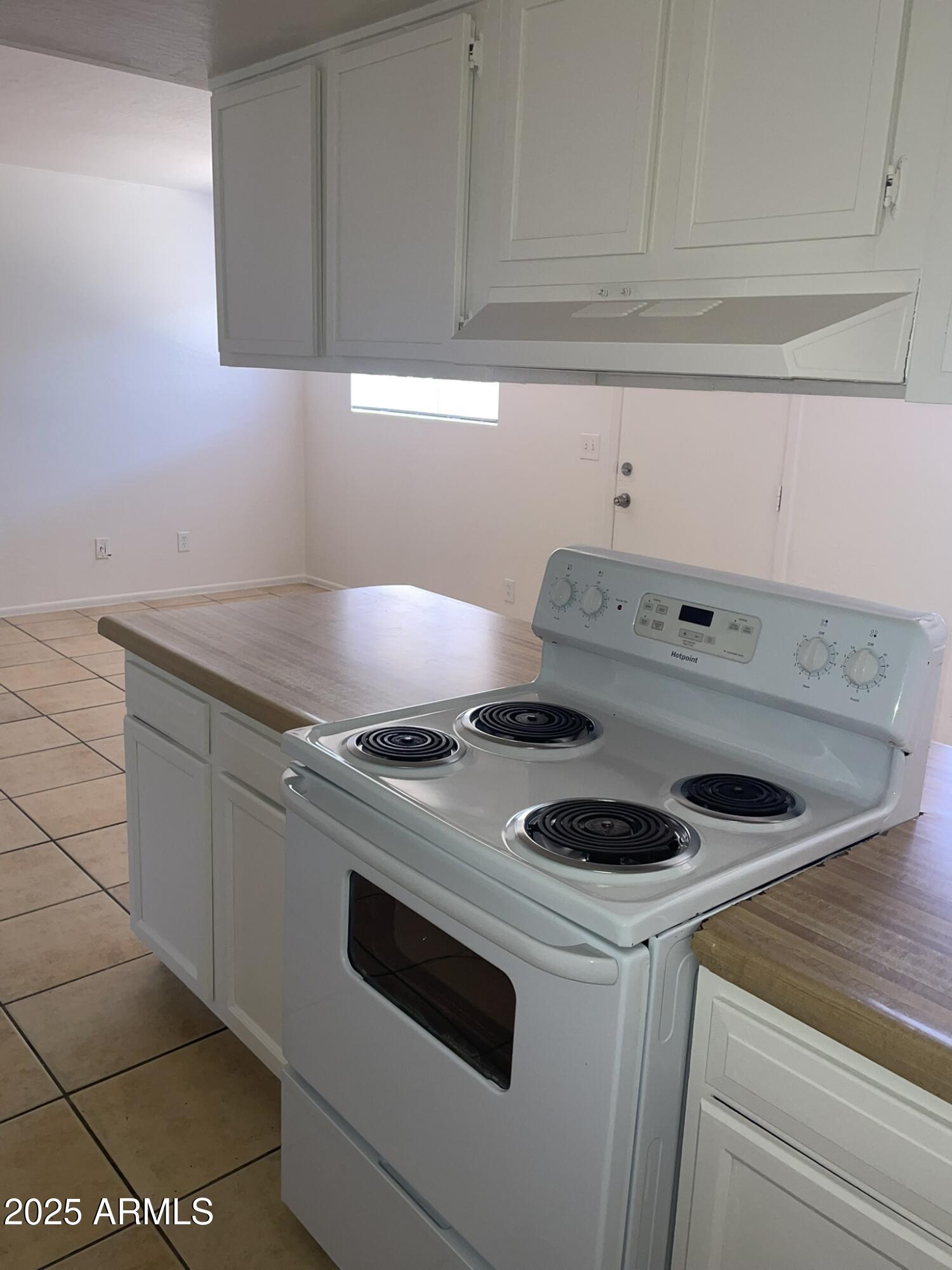 2002 East Sweetwater Avenue, Unit 108 Phoenix, AZ 85022 - Photo 15 of 25 a white stove top oven sitting inside of a kitchen