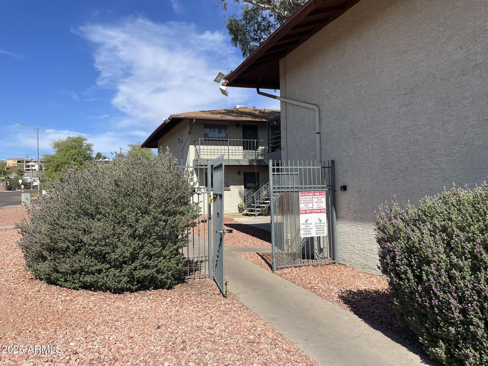 2002 East Sweetwater Avenue, Unit 108 Phoenix, AZ 85022 - Photo 21 of 25 a front view of a house with a yard