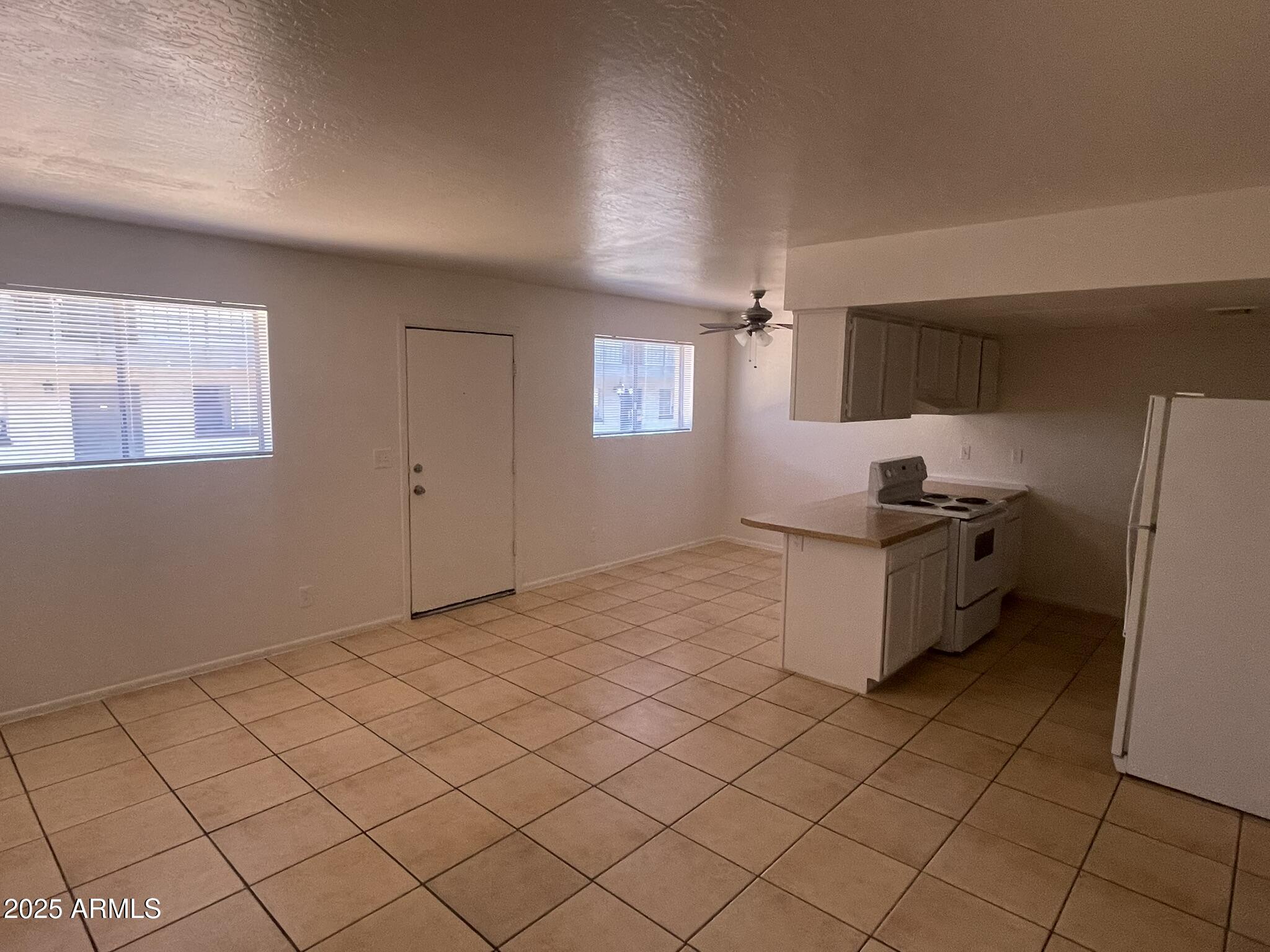 2002 East Sweetwater Avenue, Unit 108 Phoenix, AZ 85022 - Photo 6 of 25 a room with a washing machine and cabinets
