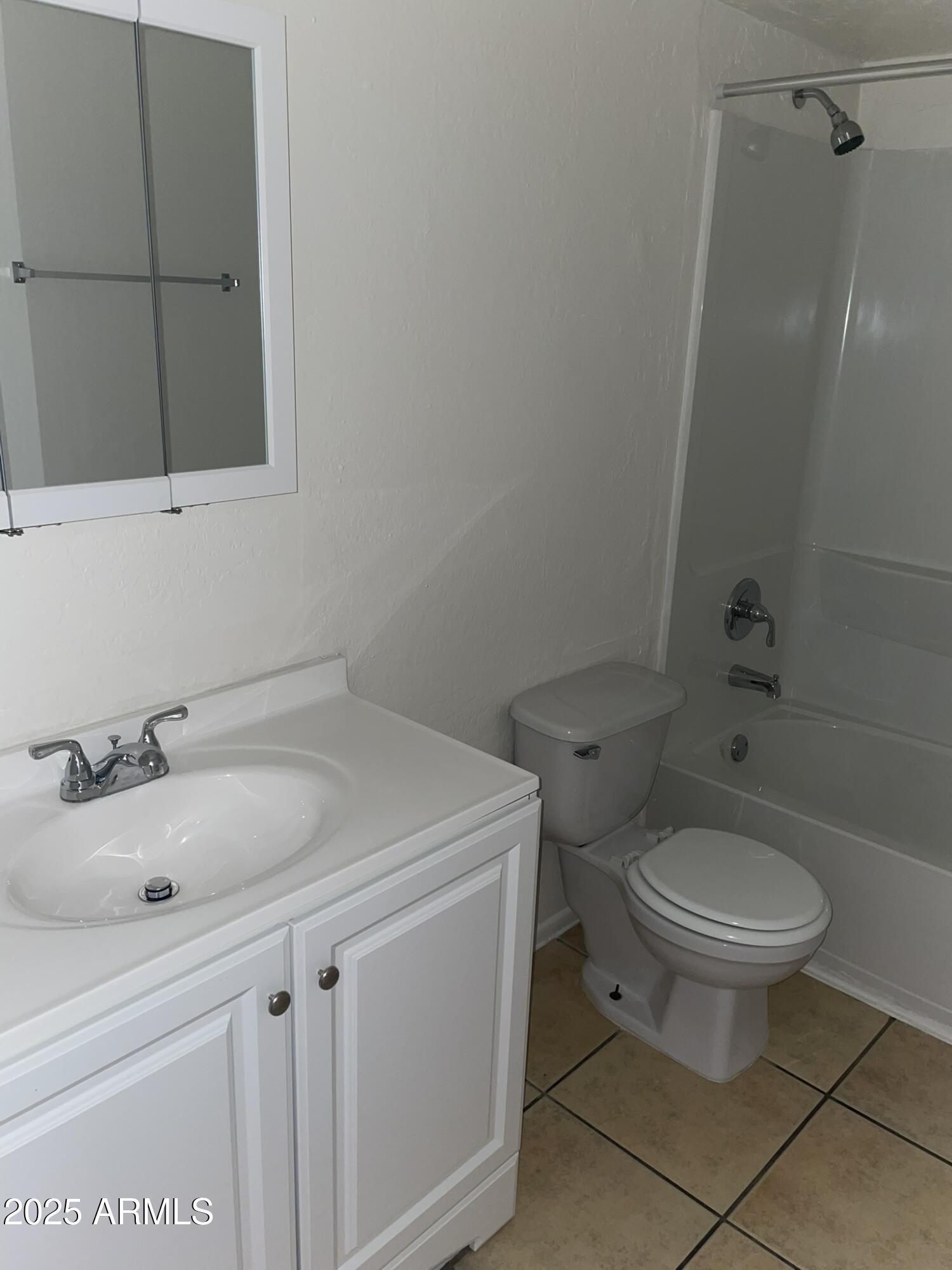 2002 East Sweetwater Avenue, Unit 108 Phoenix, AZ 85022 - Photo 8 of 25 a bathroom with a sink toilet and a mirror