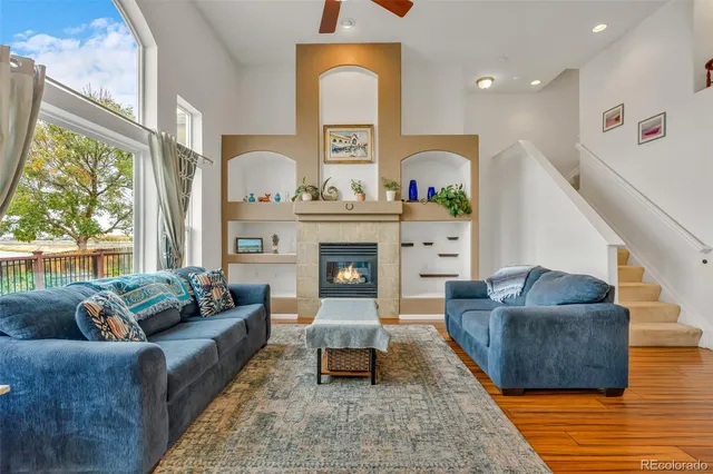 a living room with furniture and a fireplace