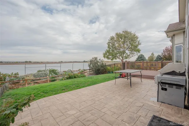 a view of a balcony with wooden floor