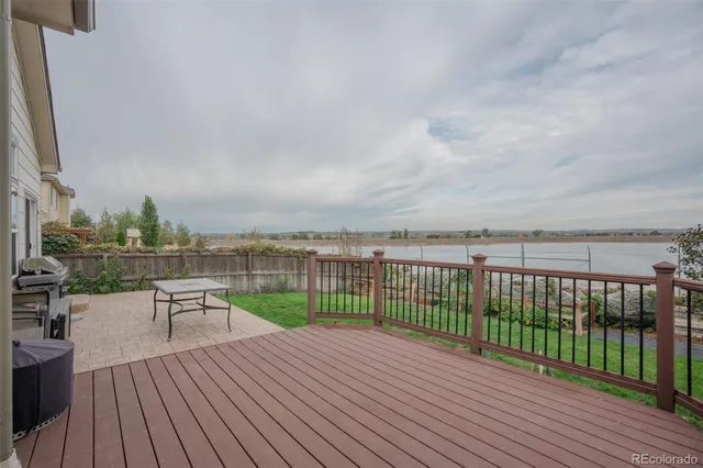 an aerial view of residential building with outdoor space and ocean view