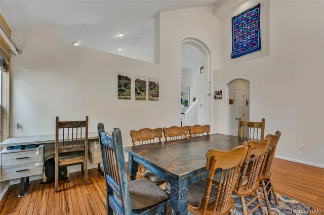 a view of a dining room with furniture and wooden floor