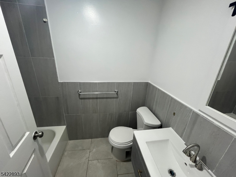 58 Wright Street, Unit 2 Newark, NJ 07114 - Photo 4 of 9 a bathroom with a toilet and a sink