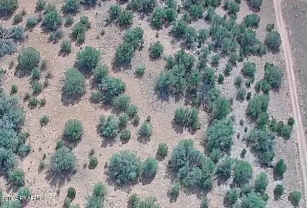 an aerial view of house with yard