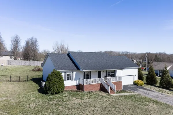 an aerial view of a house with garden