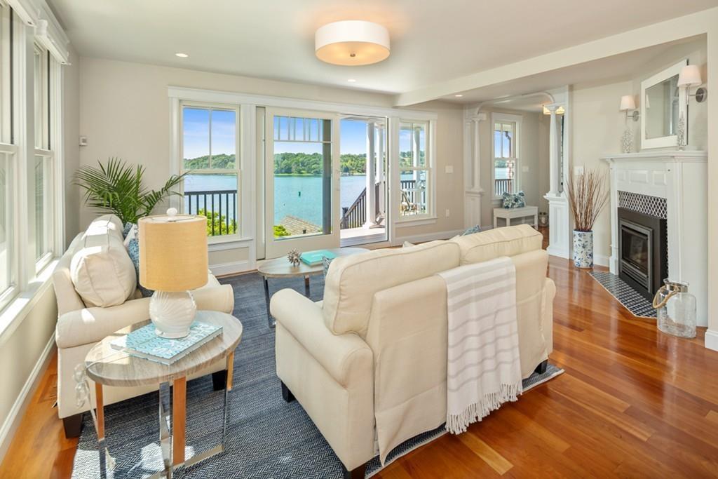 67 Hampton Circle Hull, MA 02045 - Photo 14 of 38 a living room with furniture fireplace and a large window