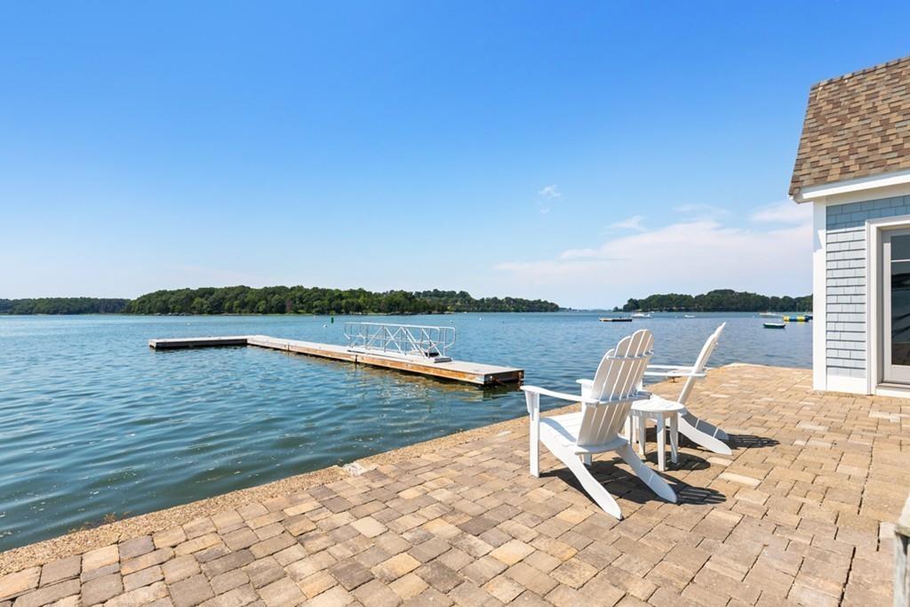 67 Hampton Circle Hull, MA 02045 - Photo 20 of 38 a view of a lake with two chairs in the patio