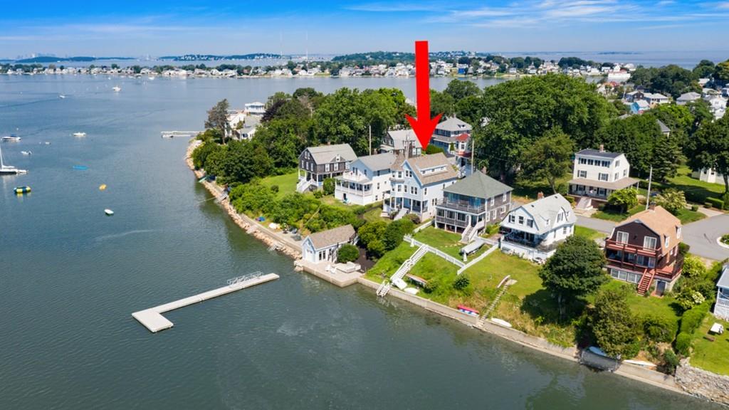 67 Hampton Circle Hull, MA 02045 - Photo 2 of 38 an aerial view of a house with a yard and lake view