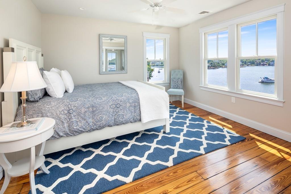 67 Hampton Circle Hull, MA 02045 - Photo 23 of 38 a bedroom with a bed and a window with wooden floor