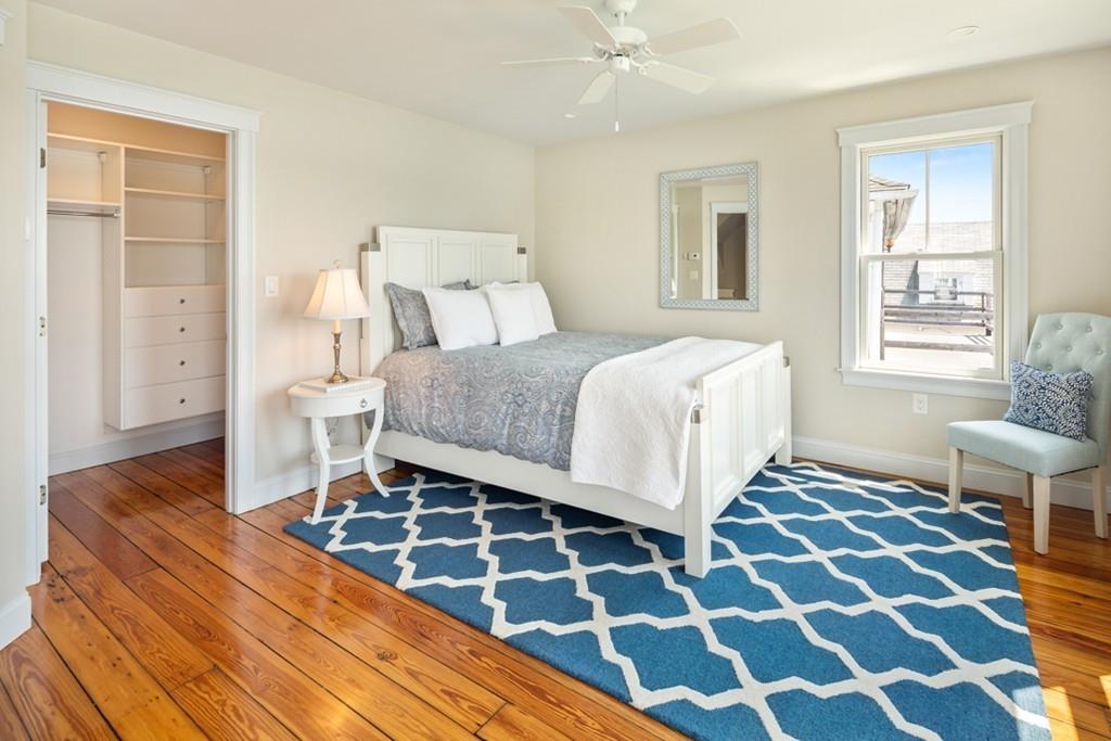 67 Hampton Circle Hull, MA 02045 - Photo 25 of 38 a bedroom with a bed and wooden floor