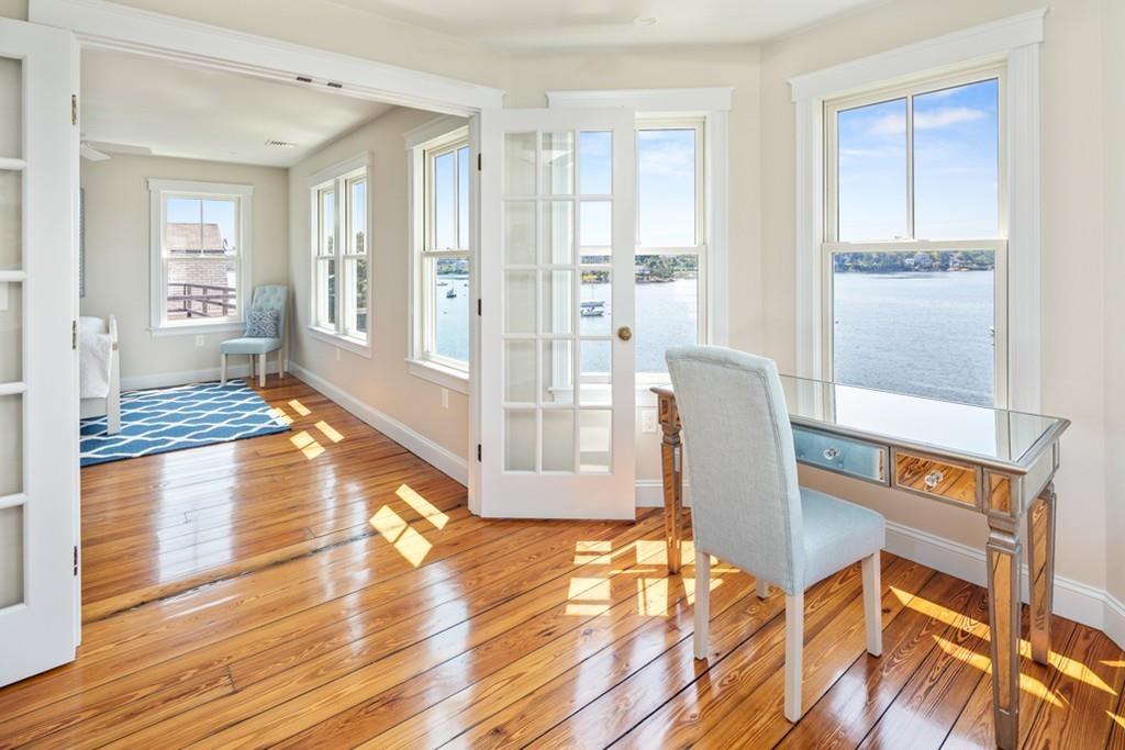 67 Hampton Circle Hull, MA 02045 - Photo 28 of 38 a dining room with wooden floor and a rug