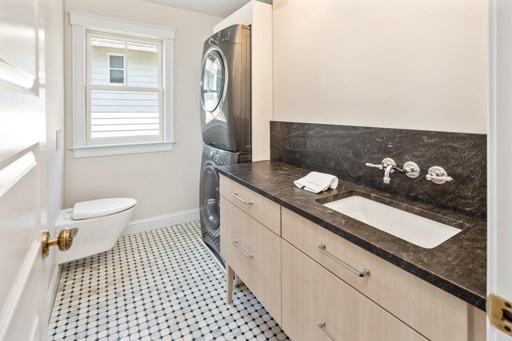 67 Hampton Circle Hull, MA 02045 - Photo 30 of 38 a bathroom with a sink a toilet and a mirror