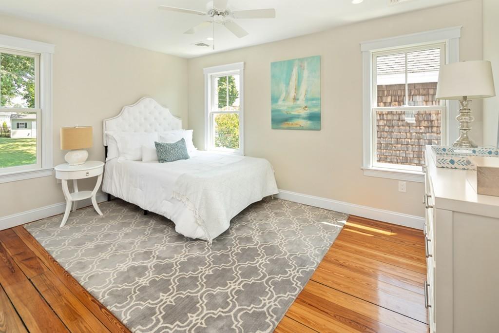 67 Hampton Circle Hull, MA 02045 - Photo 32 of 38 a bedroom with a bed and windows