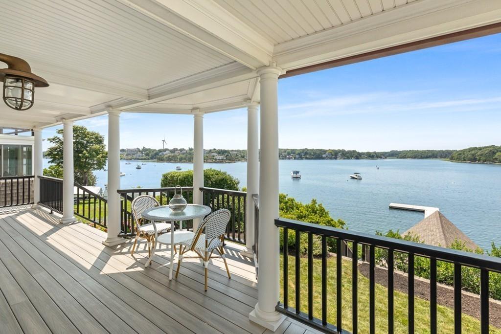 67 Hampton Circle Hull, MA 02045 - Photo 5 of 38 a view of a balcony with chairs and wooden floor