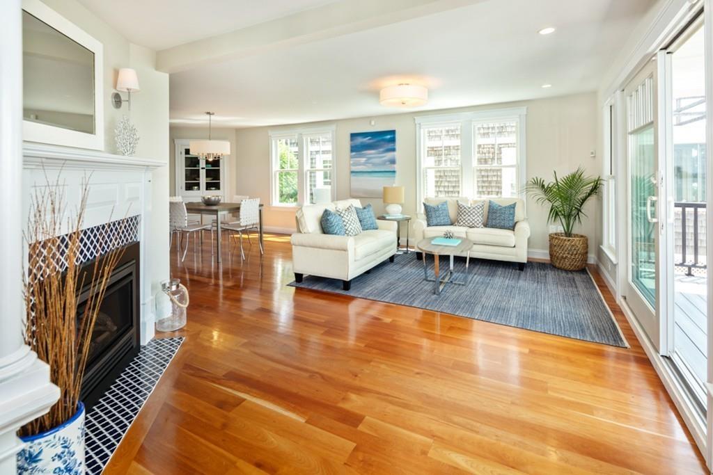 67 Hampton Circle Hull, MA 02045 - Photo 8 of 38 a living room with furniture wooden floor and a fireplace