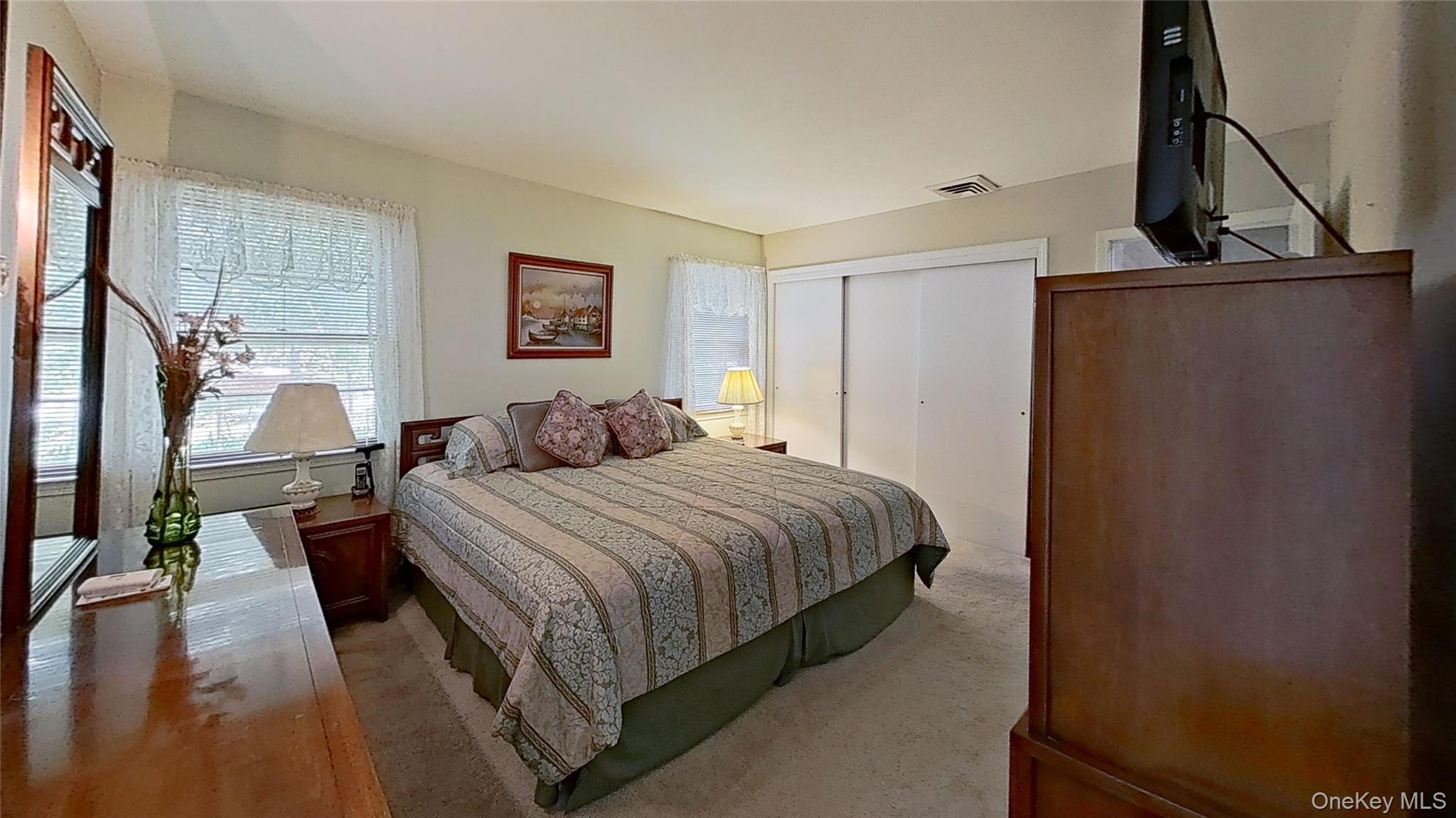 347 Miller Place Road Miller Place, NY 11764 - Photo 12 of 29 The primary bedroom is big and bright with closet(s)too!