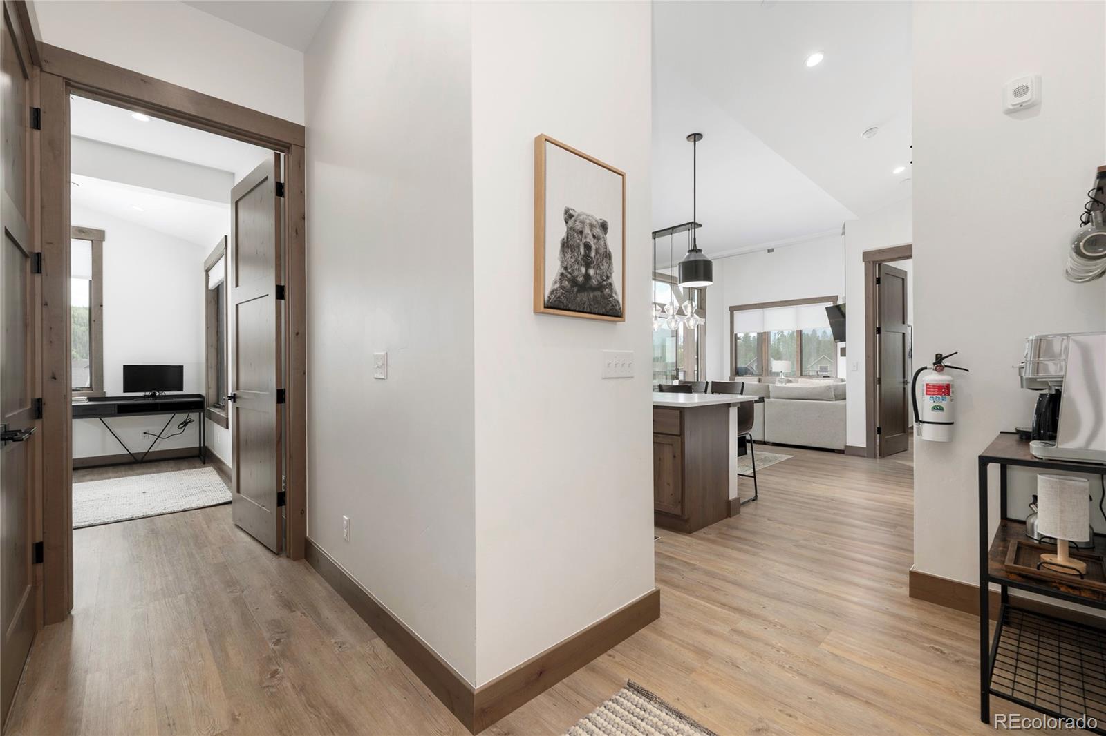 96 Meadow Trail, Unit G304 Fraser, CO 80442 - Photo 15 of 38 a kitchen with stainless steel appliances a refrigerator and a wooden floor