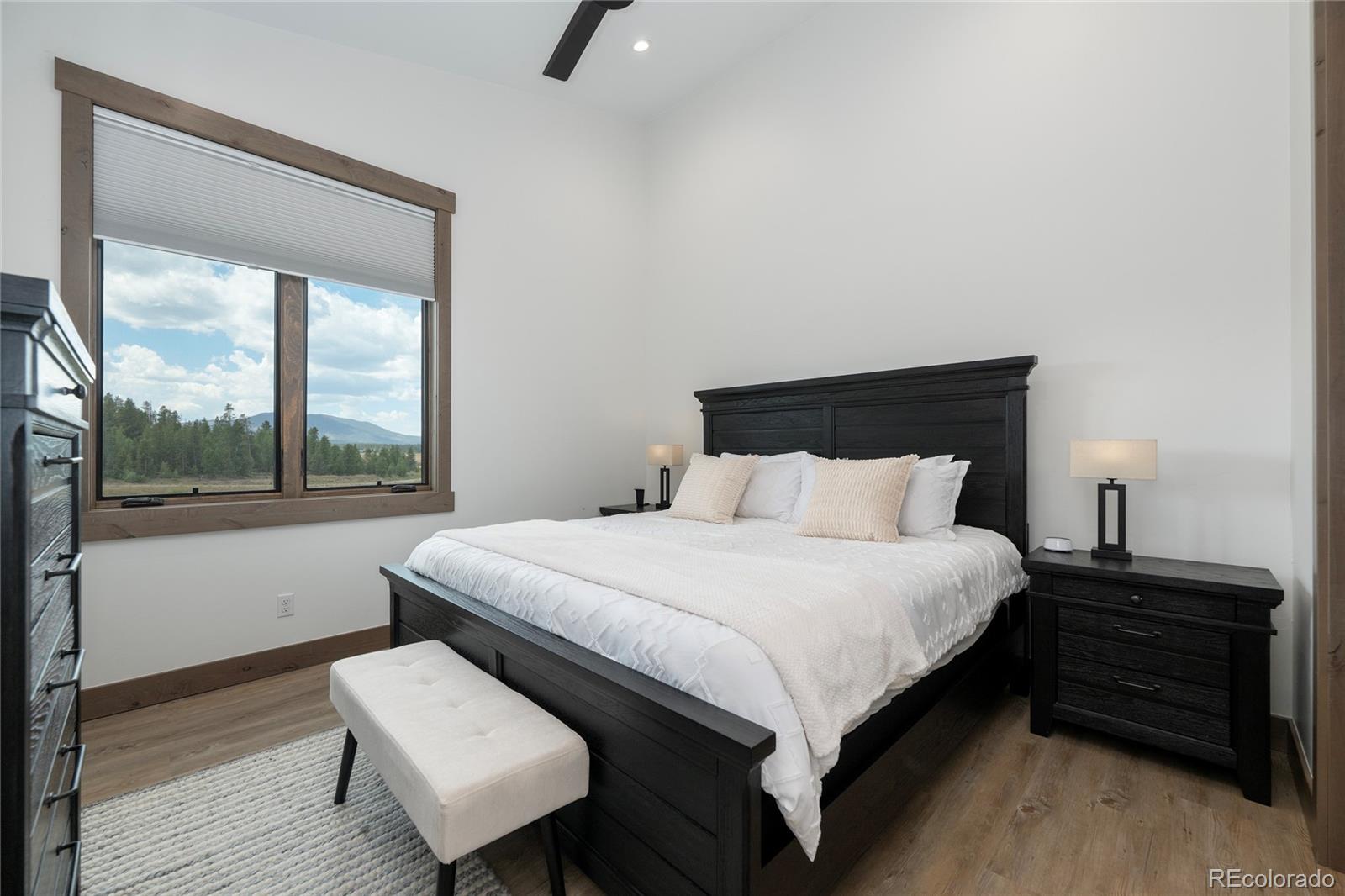 96 Meadow Trail, Unit G304 Fraser, CO 80442 - Photo 24 of 38 a bedroom with a bed and a window