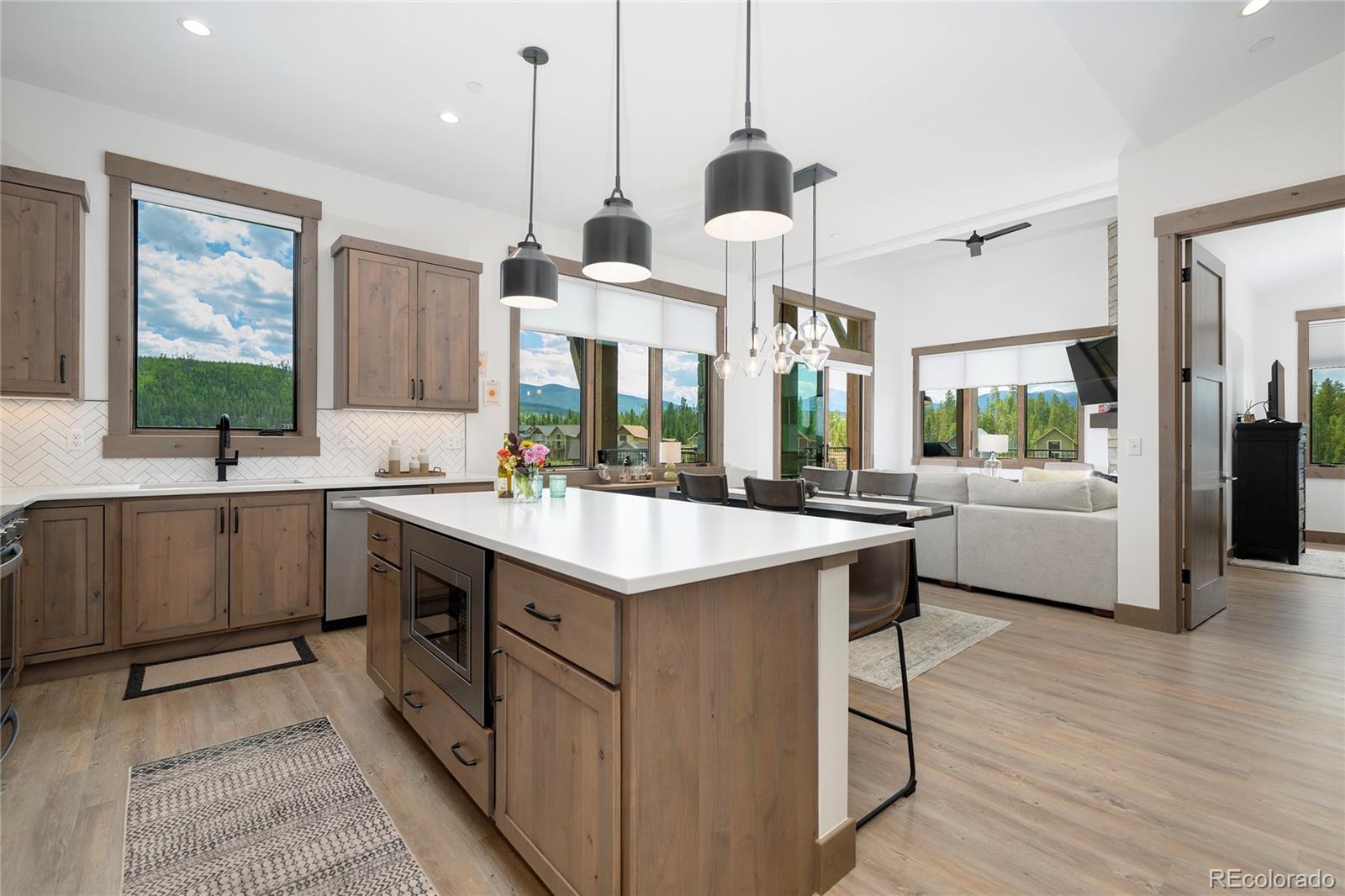 96 Meadow Trail, Unit G304 Fraser, CO 80442 - Photo 29 of 38 a kitchen with a sink counter top space and appliances