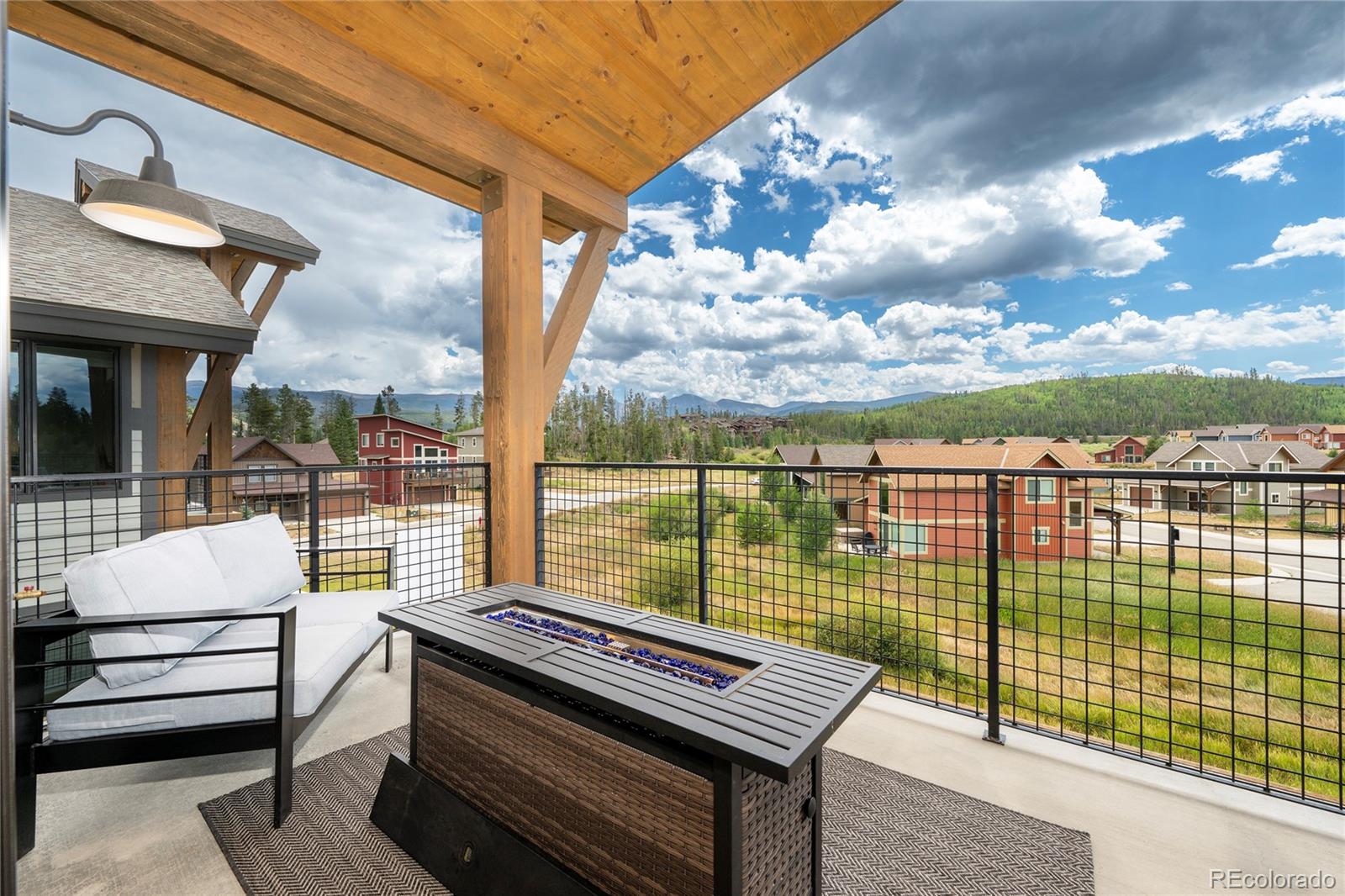 96 Meadow Trail, Unit G304 Fraser, CO 80442 - Photo 6 of 38 a view of a patio with a lake view