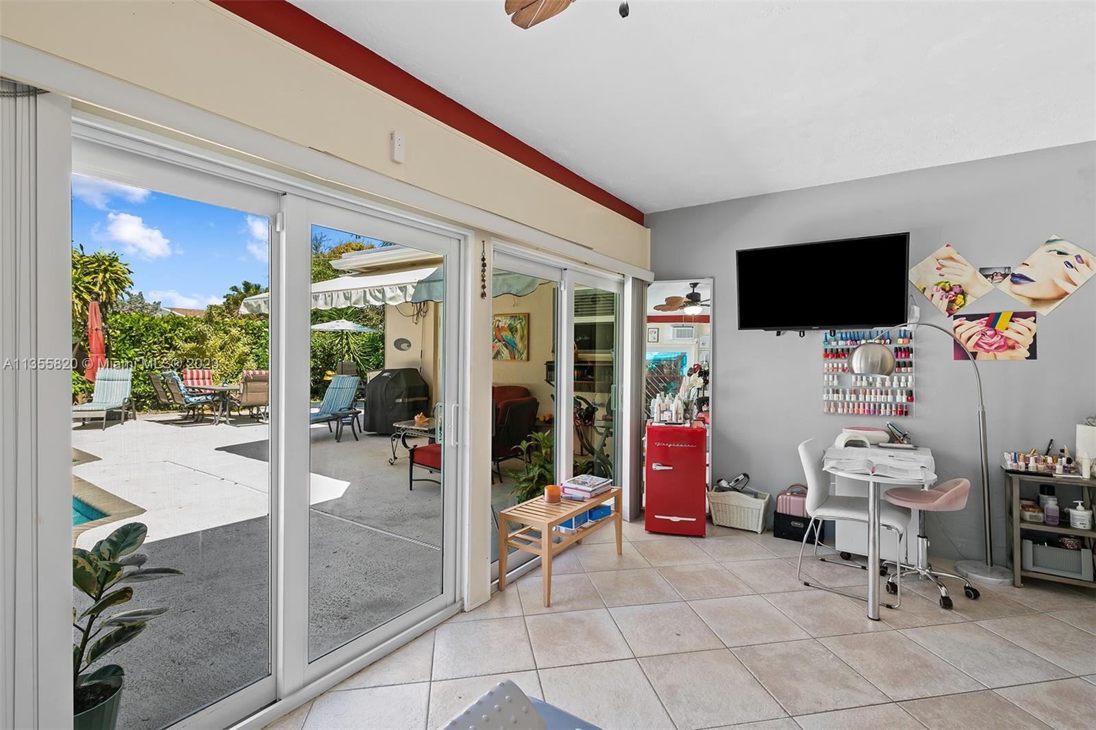 3731 Thomas Street Hollywood, FL 33021 - Photo 12 of 21 a living room with furniture and a flat screen tv