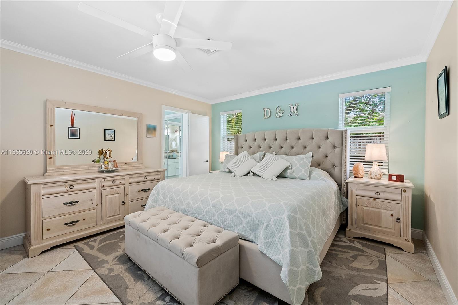 3731 Thomas Street Hollywood, FL 33021 - Photo 13 of 21 a bedroom with a bed and a dresser