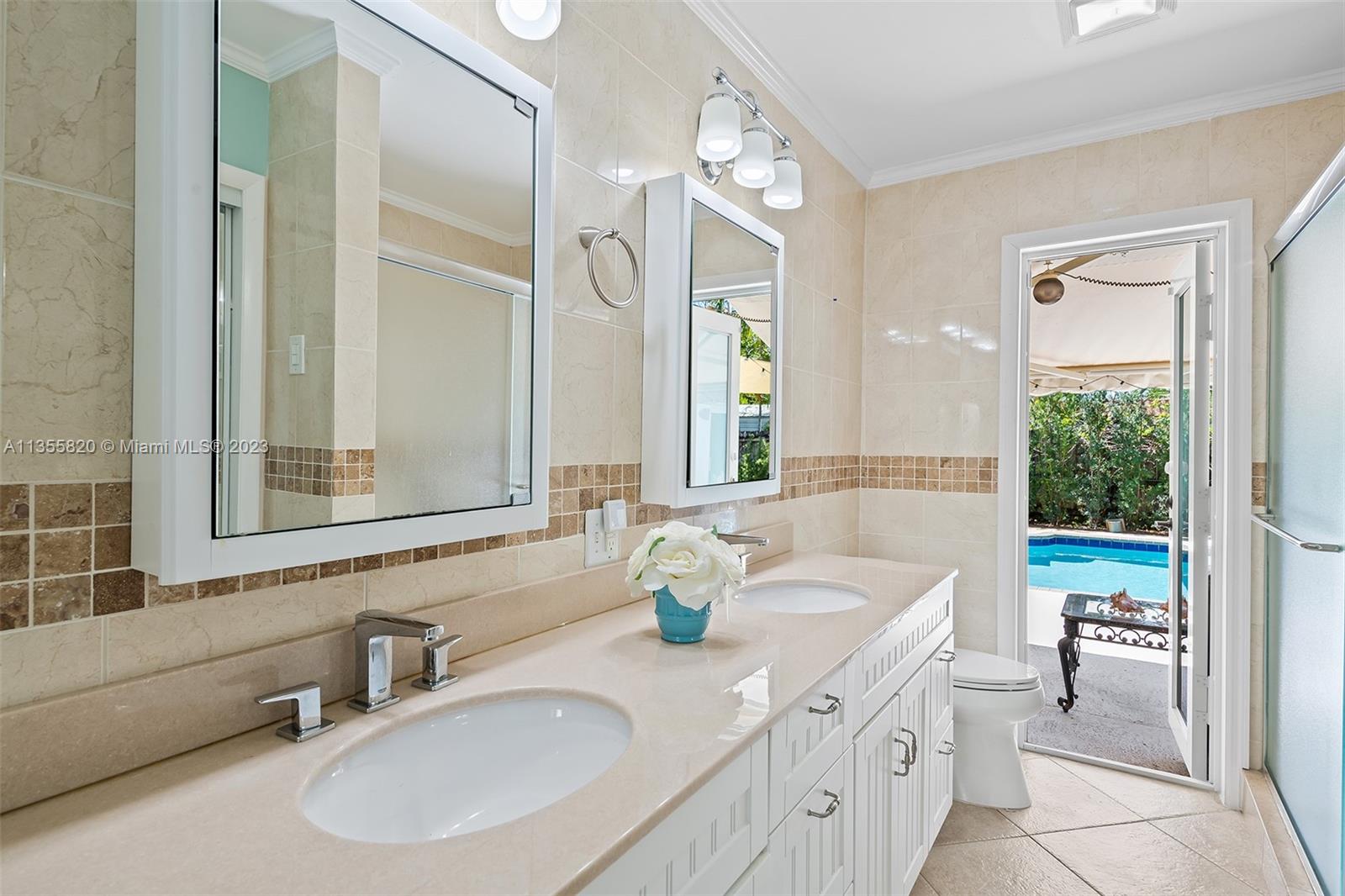 3731 Thomas Street Hollywood, FL 33021 - Photo 14 of 21 a bathroom with a sink double vanity and a tub