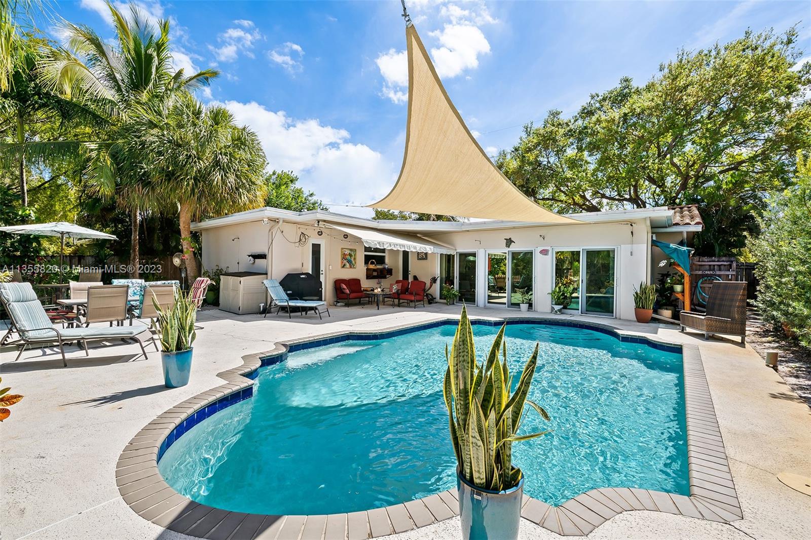 3731 Thomas Street Hollywood, FL 33021 - Photo 20 of 21 a view of a house with swimming pool and sitting area