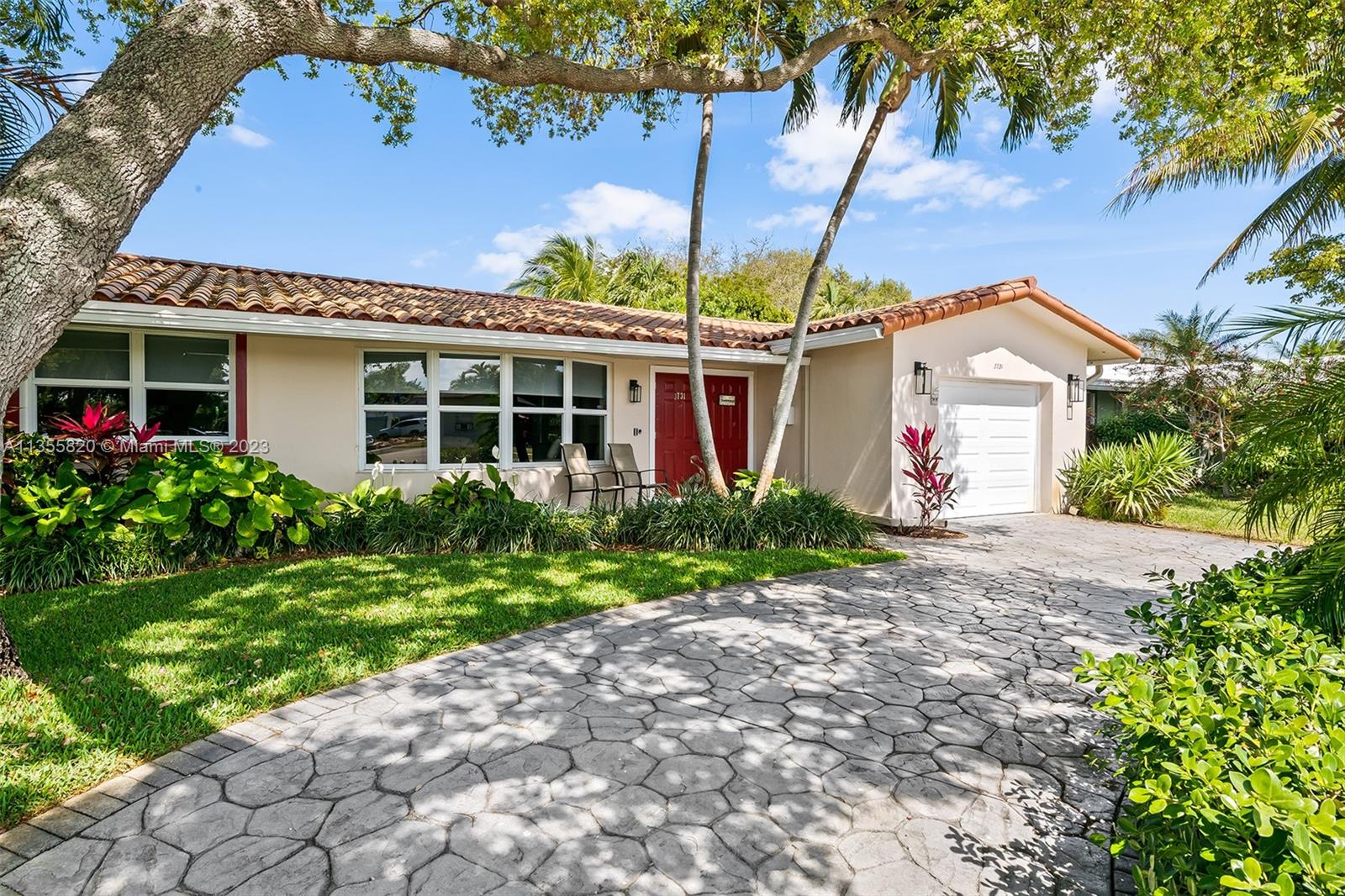 3731 Thomas Street Hollywood, FL 33021 - Photo 3 of 21 a front view of a house with garden