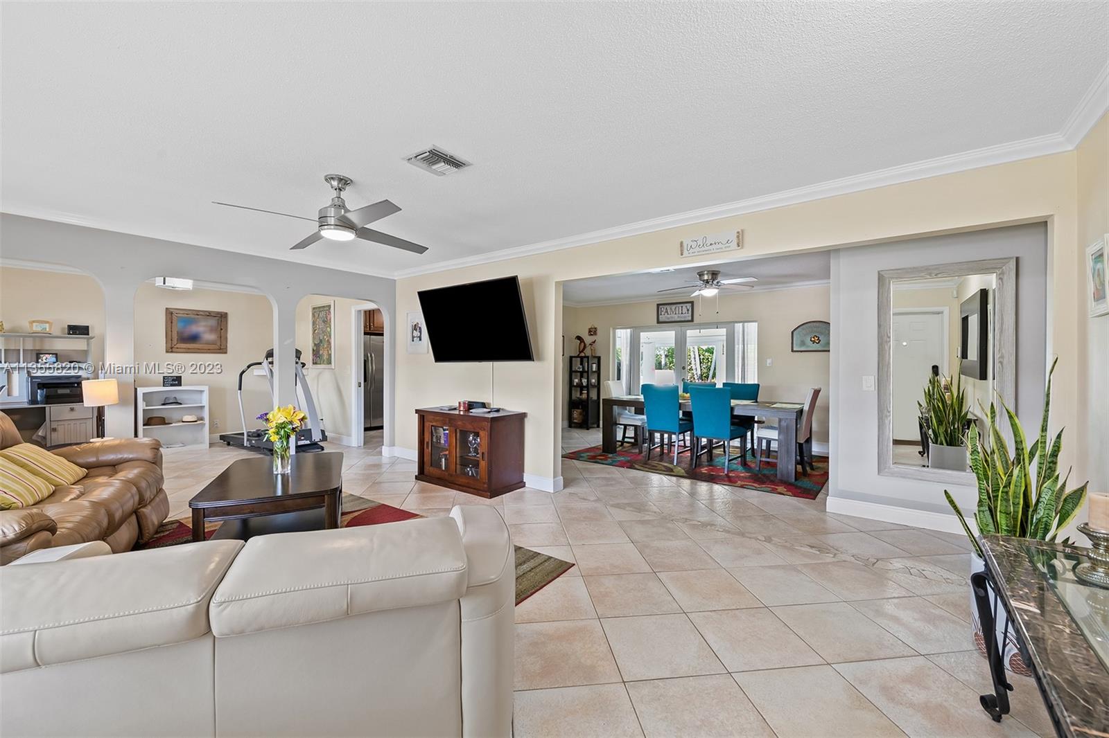 3731 Thomas Street Hollywood, FL 33021 - Photo 4 of 21 a living room with furniture and a flat screen tv