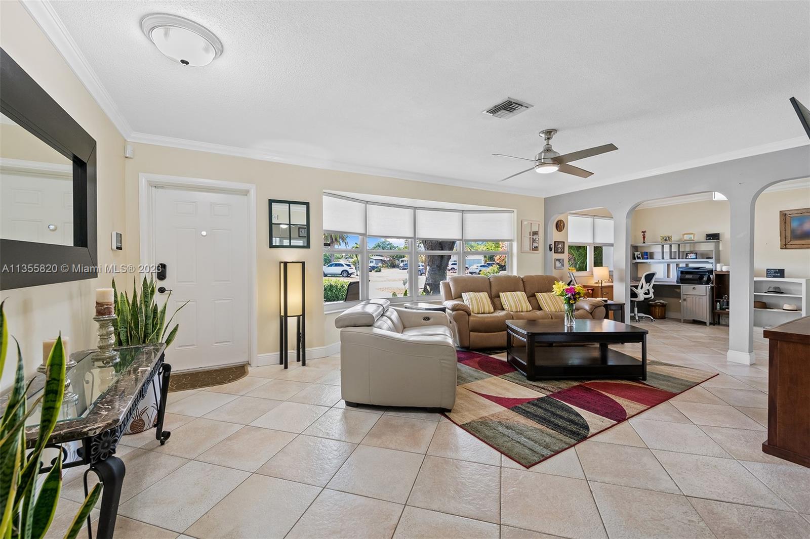 3731 Thomas Street Hollywood, FL 33021 - Photo 6 of 21 a living room with furniture and a dining table with kitchen view